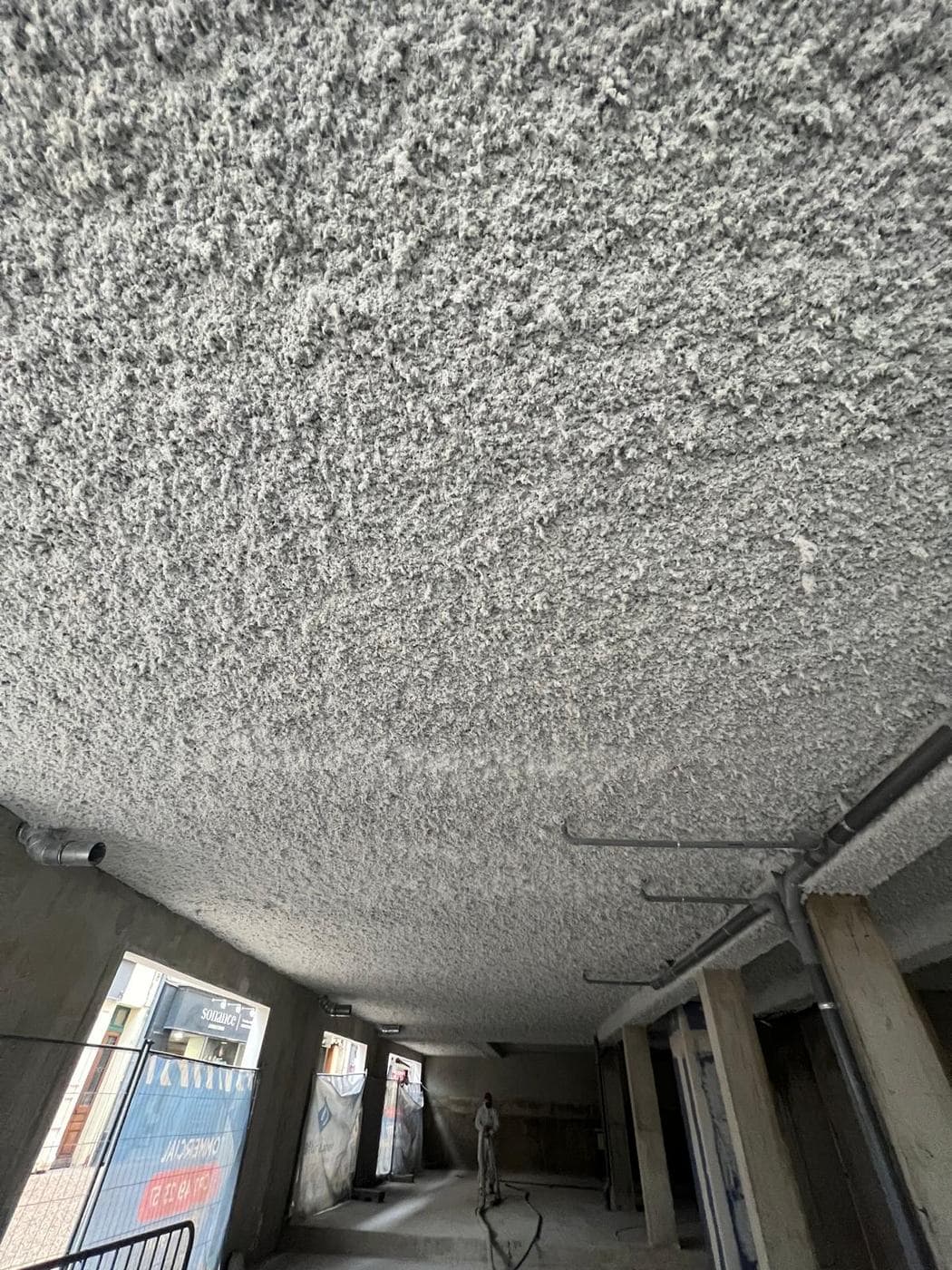 Flocage isolation thermique — Sous-face de dalle haute de parking